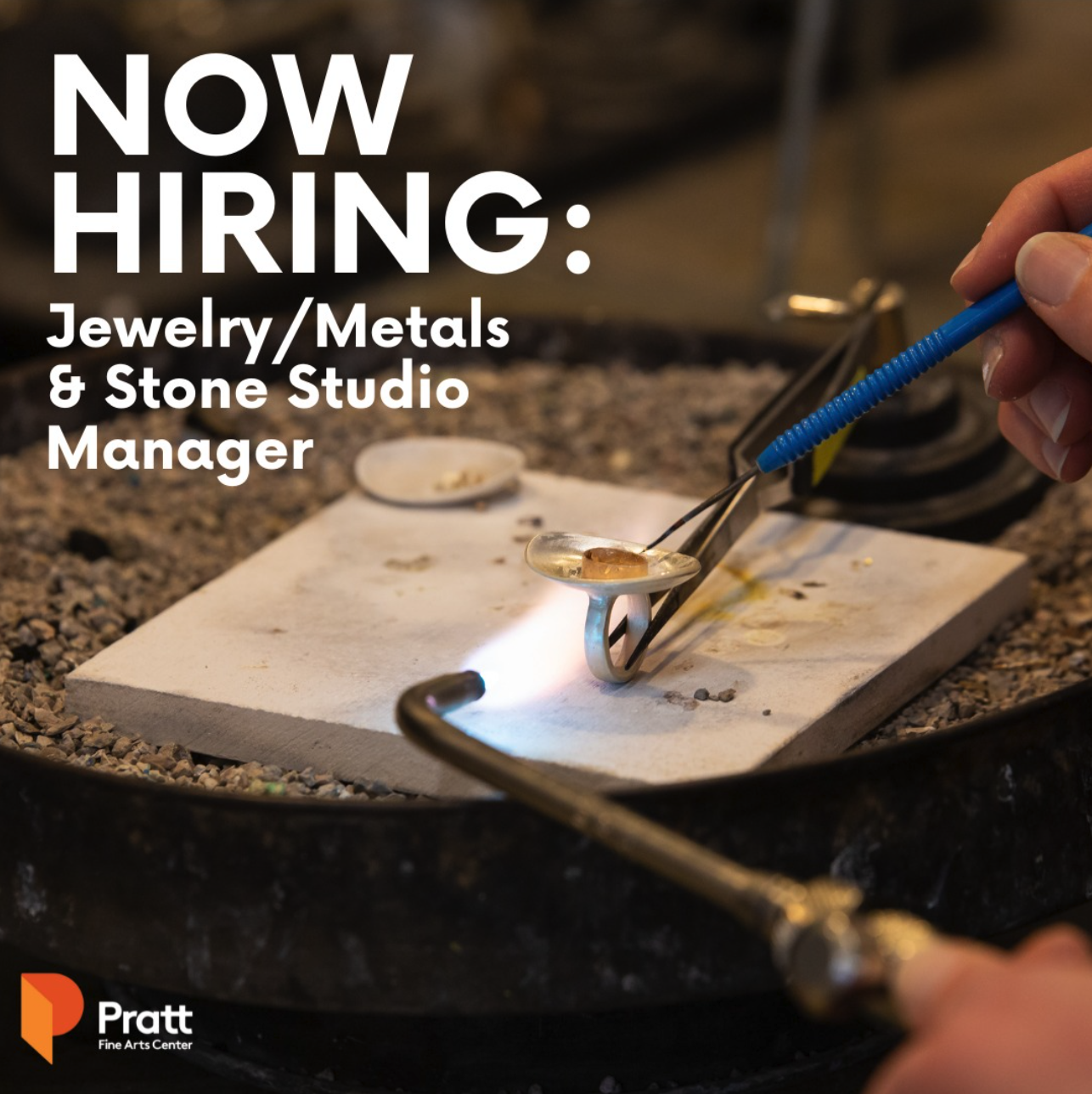 Person soldering a ring in Pratt's Jewelry Studio with 'Now Hiring' info; photo credit: @alecmillerarts.